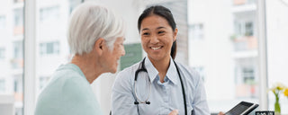 Smiling doctor with a patient