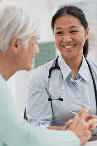 Smiling doctor with a patient
